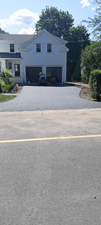 an asphalt driveway of a residential property