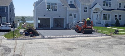 a truck paving a driveway