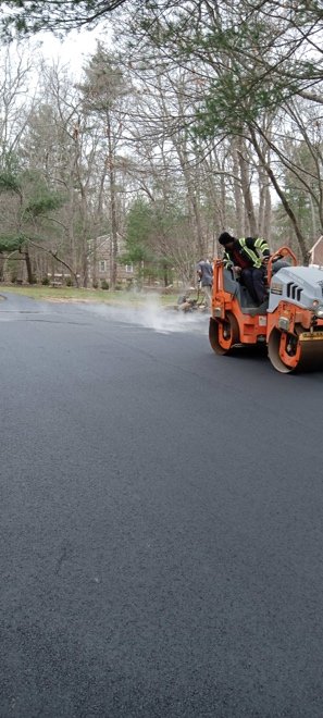 a truck paving a road 