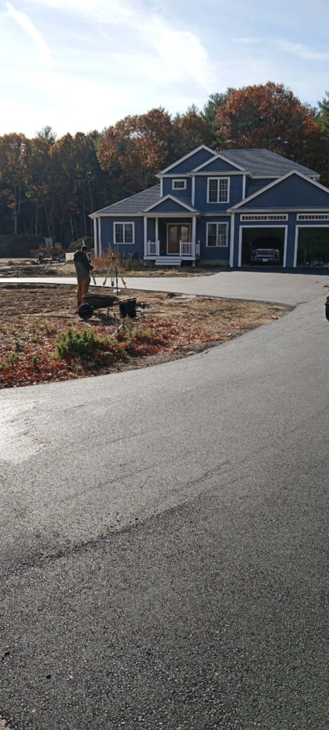 a pavement leading to a house 