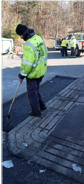 A paving contractor working on a residential paving project