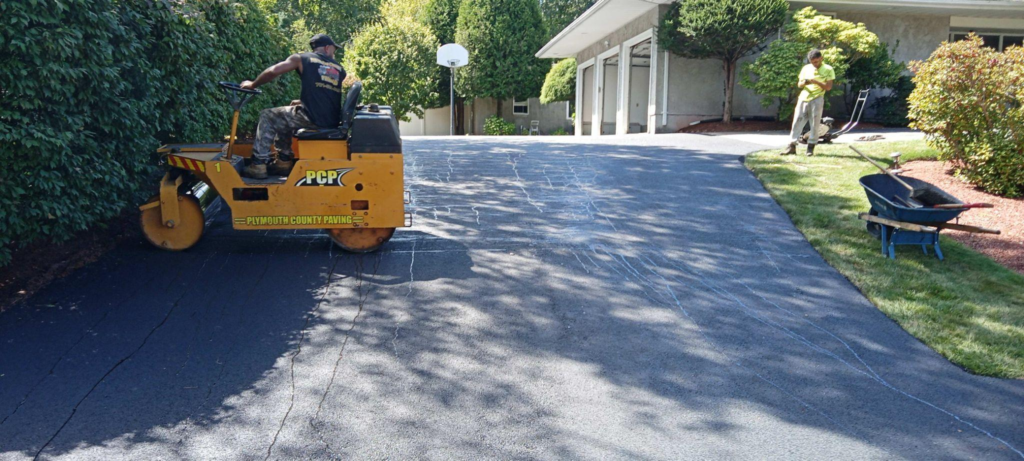 a driveway being paved with asphalt