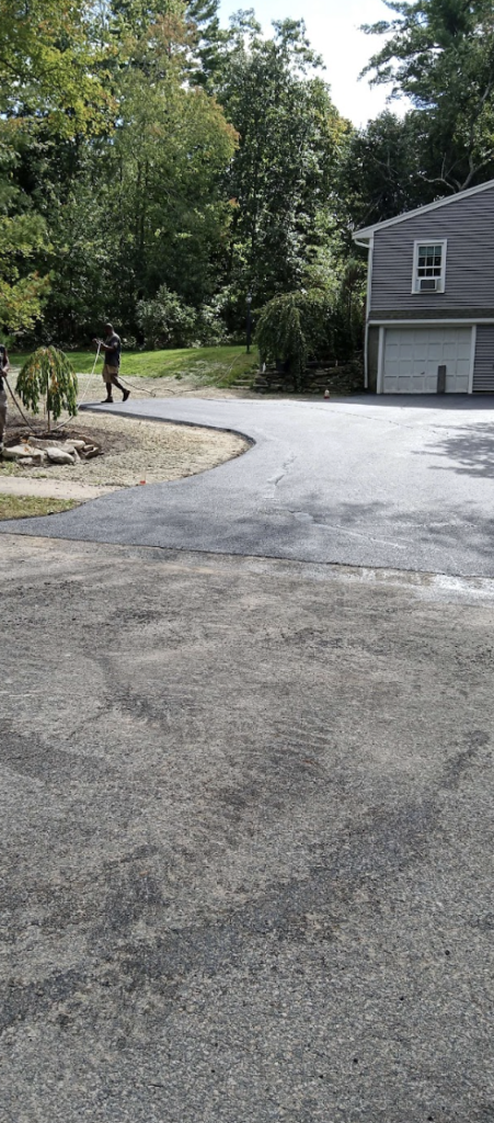 This image shows a man doing repairs near a house.