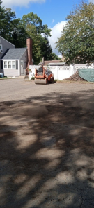 Cracked asphalt into the base layer causing structural weakening beneath the pavement.